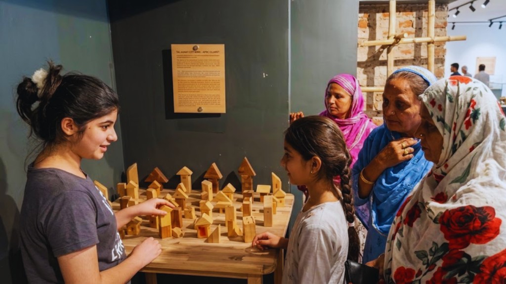 Visitors engaging with an exhibit inside Mehnat Manzil, Museum of Work, Ahmedabad