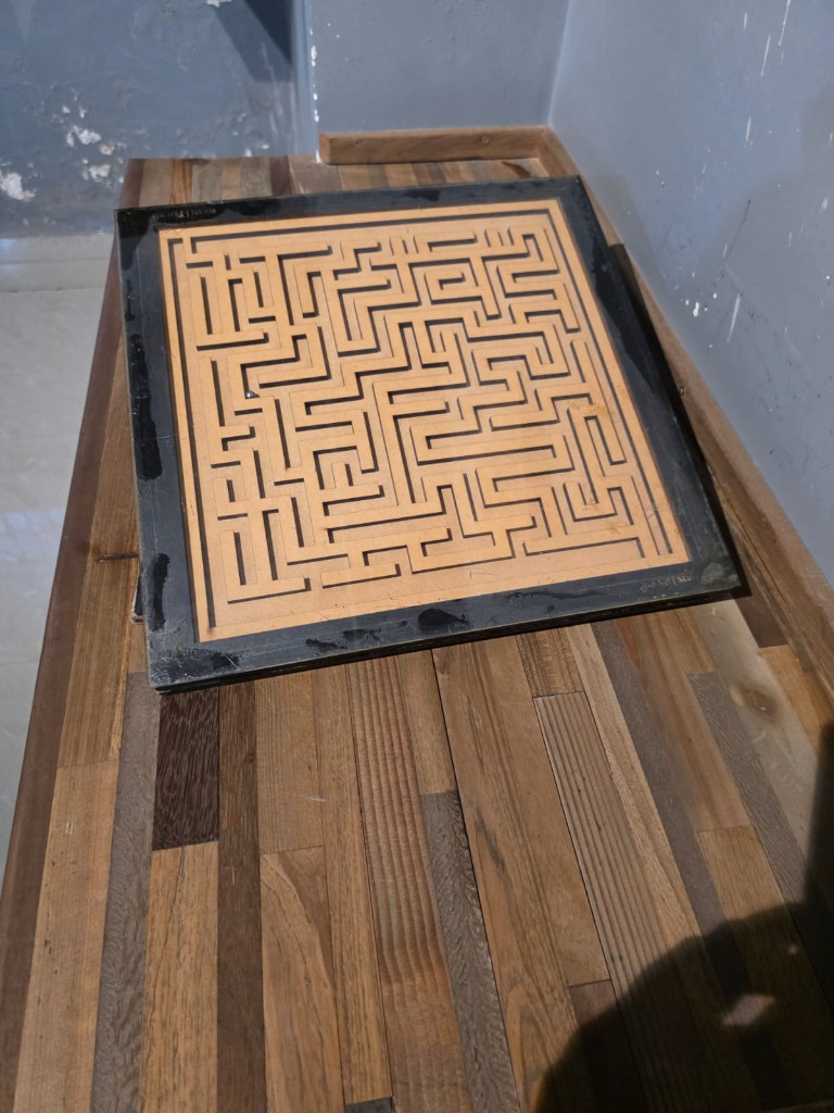 A maze game representing structural barriers in informal work